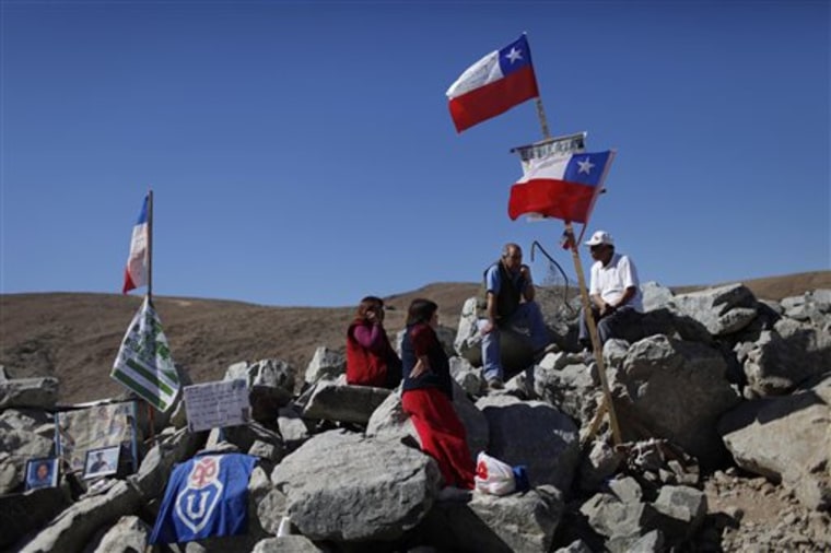 Relatives of 33 trapped miners wait for news outside the collapsed mine San Jose in Copiapo, Chile, Wednesday. The miners have been trapped since the shaft they were working in collapsed on Aug. 5.